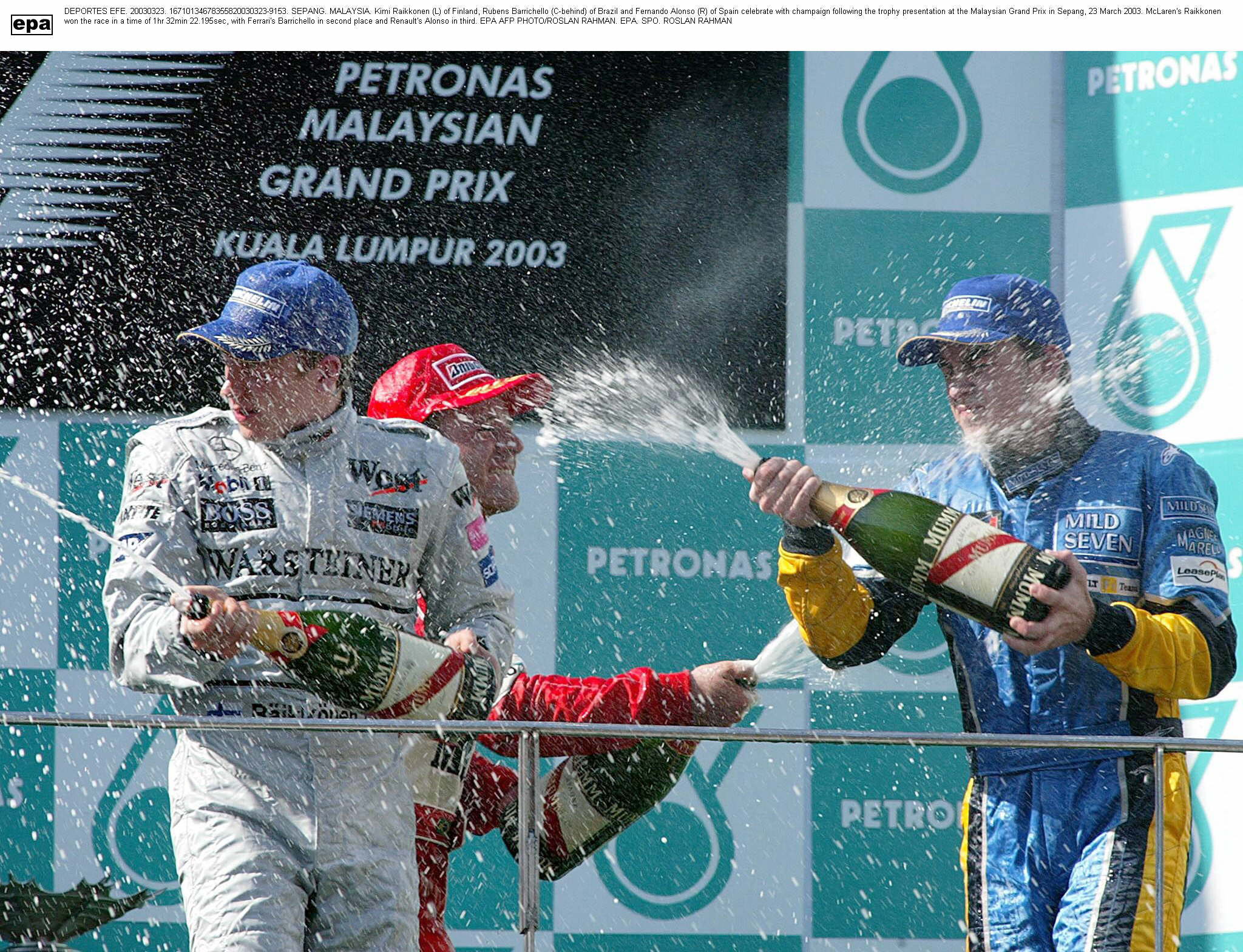 Raikkonen, Barrichello y Alonso en el podio de 2003. Primera victoria...
