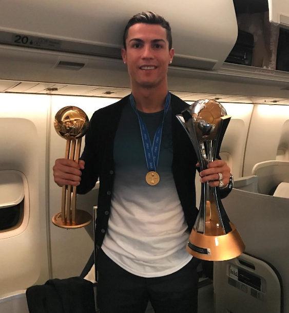 Cristiano Ronaldo with two trophies