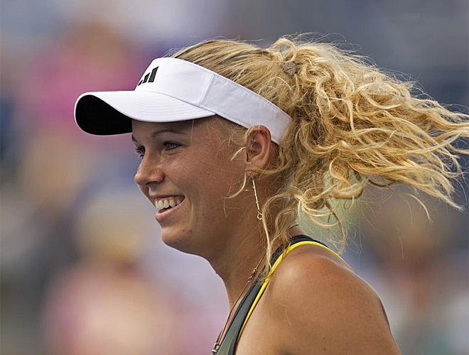 Hasta la derrota en semifinales con la rusa Zvonareva, Wozniacki luci su sonrisa en el US Open.