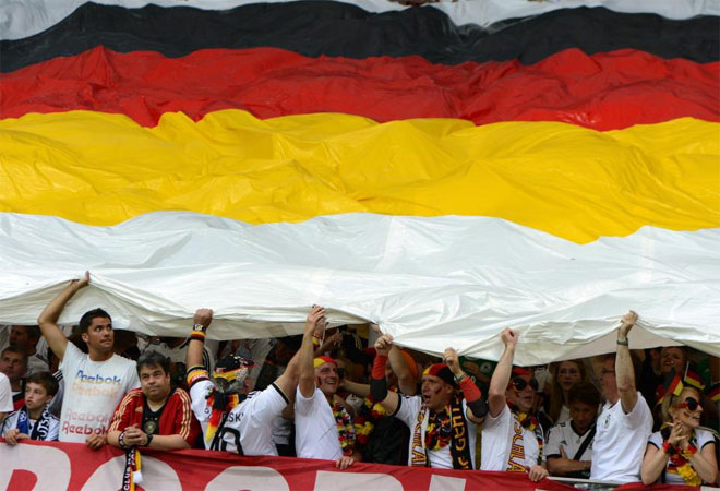 German fans hold a flag during the Euro 2012 football championships semi-final match Germany vs Italy.