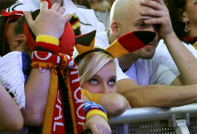 German soccer fan react during a public screening of the Euro 2012 semi-final between Germany and Italy.