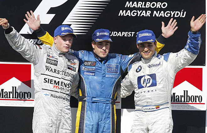 Imagen del podio de 2003. Fernando Alonso subi a lo ms alto del cajn escoltado por Kimi Raikkonen y Juan Pablo Montoya.