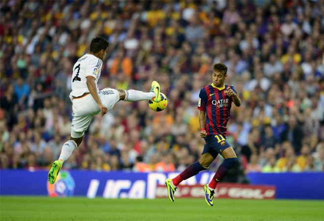 Raphael Varane vies with Neymar during the Spanish league Clasico football match.