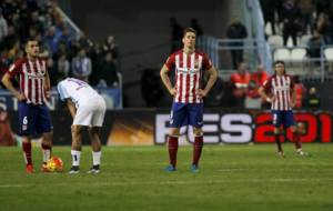 Koke, Torres y Filipe tras el gol del Mlaga que signific la...