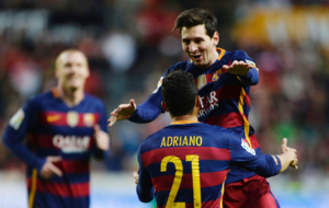 Lionel Messi celebra con su compaero de equipo Adriano uno de los...
