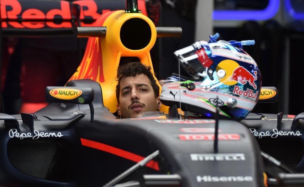 Red Bull Racing's Australian driver Daniel Ricciardo sits in his...