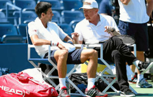Novak Djokovic, junto a Boris Becker, durante el US Open de 2014.