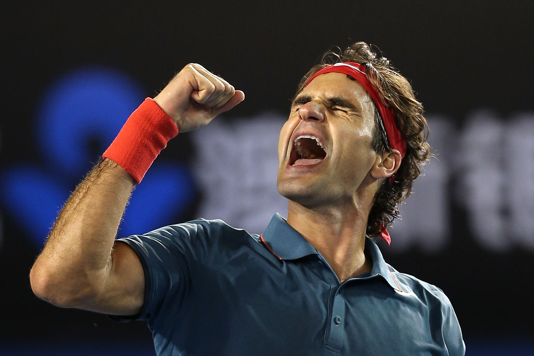 Federer celebra una victoria en el Open de Australia 2014.