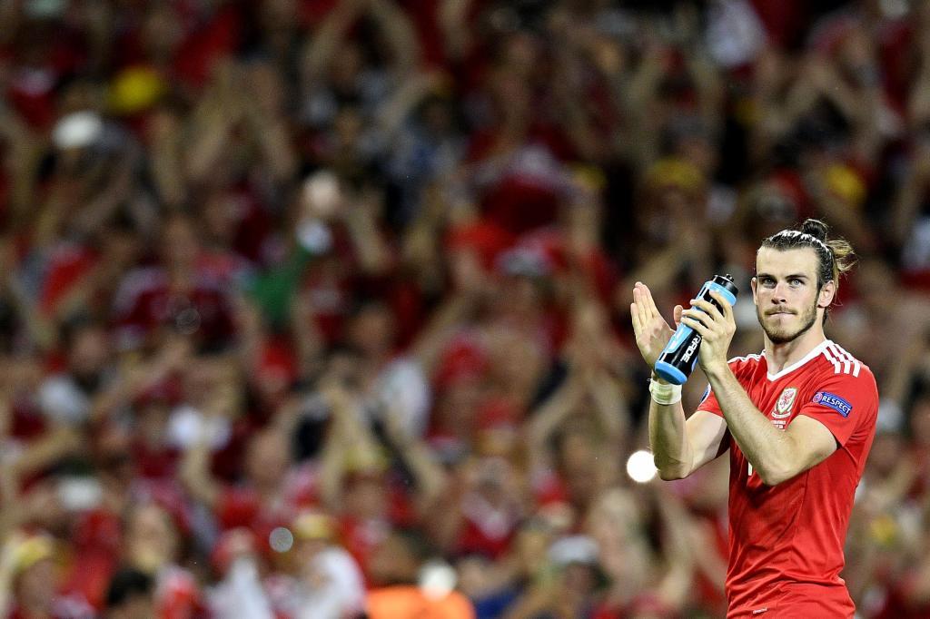 Wales&apos; forward Gareth Bale celebrates their 3-0 win in the Euro 2016...