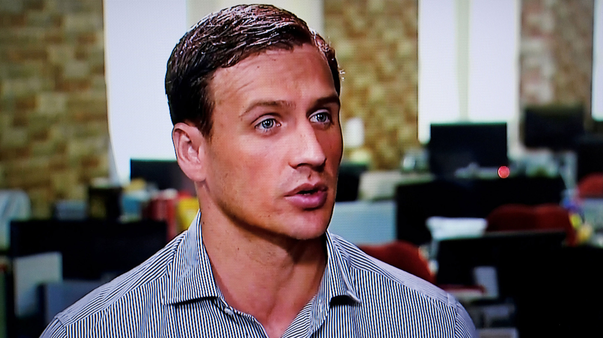 Ryan Lochte of the U.S. gives an interview to Globo TV at their...