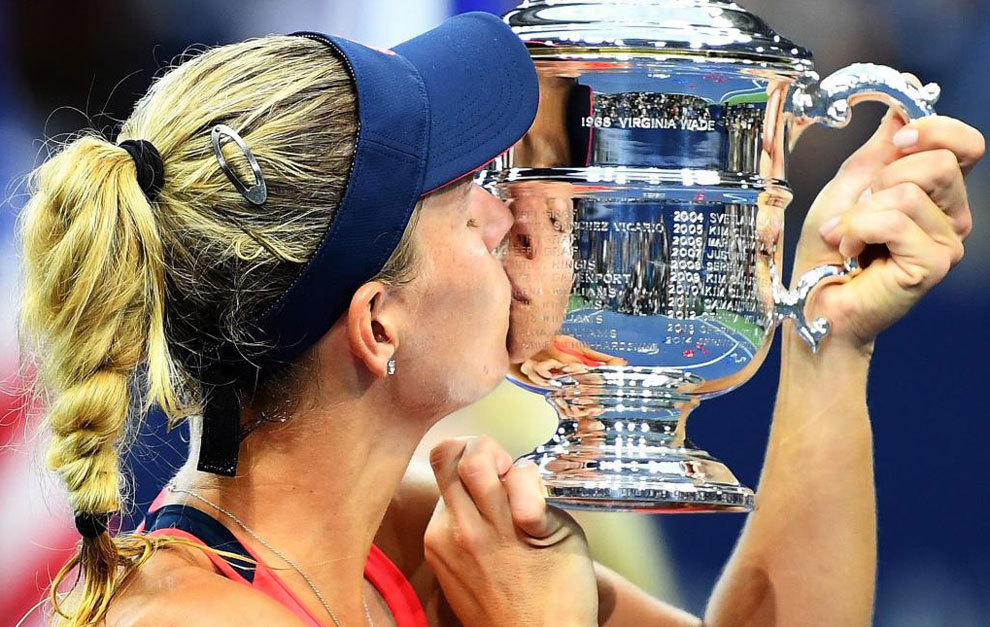 Angelique Kerber kisses the trophy after winning the 2016 US Open.