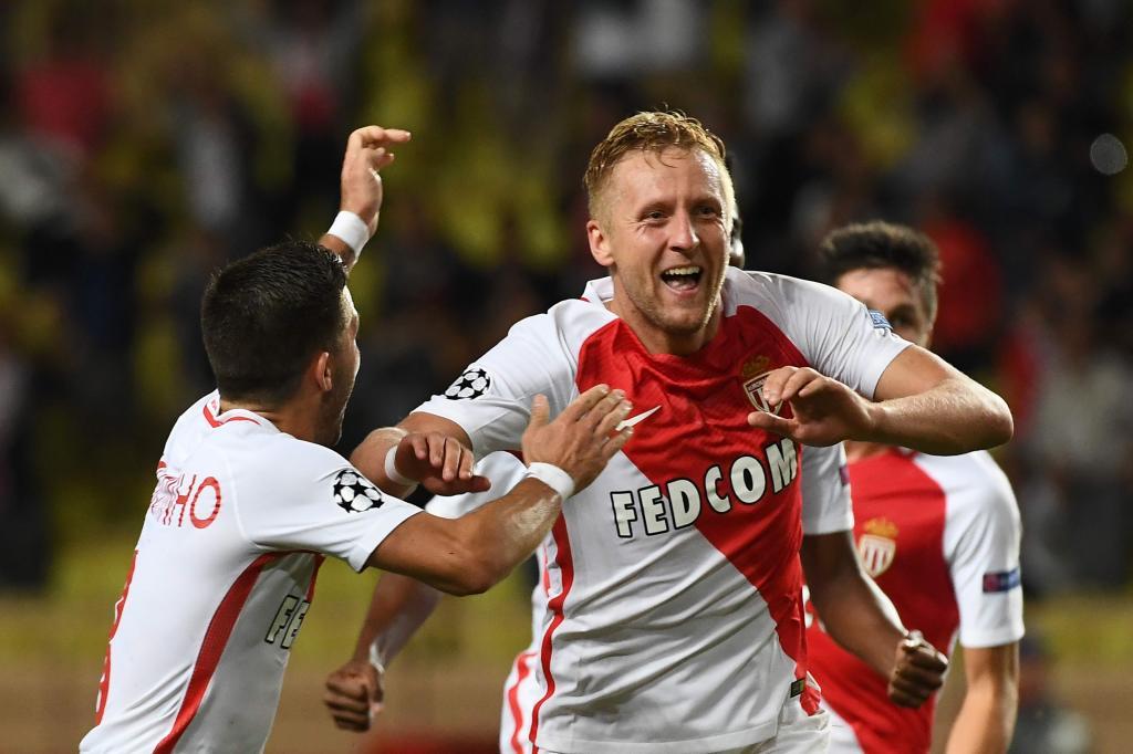Monaco&apos;s Polish defender Kamil Glik (C) celebrates after scoring a...
