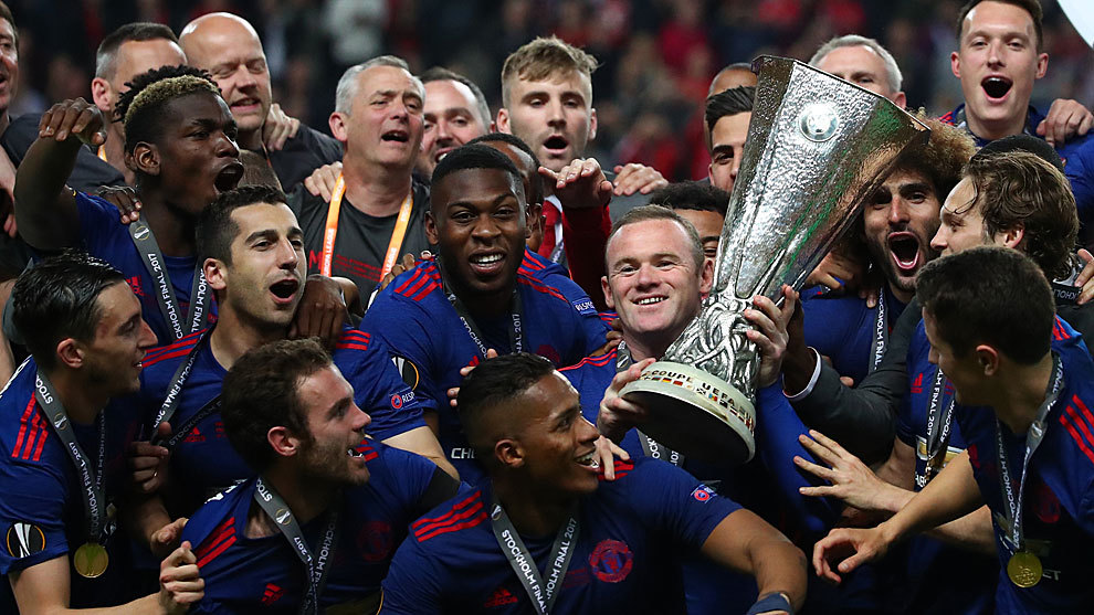 Rooney clutches the Europa League trophy