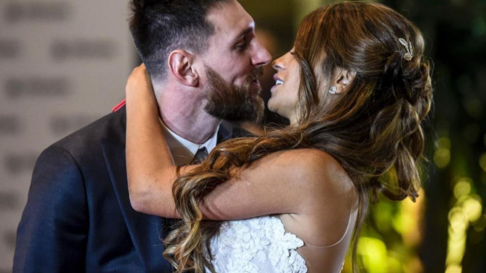 TOPSHOT - Argentine football star Lionel Messi and bride Antonella...