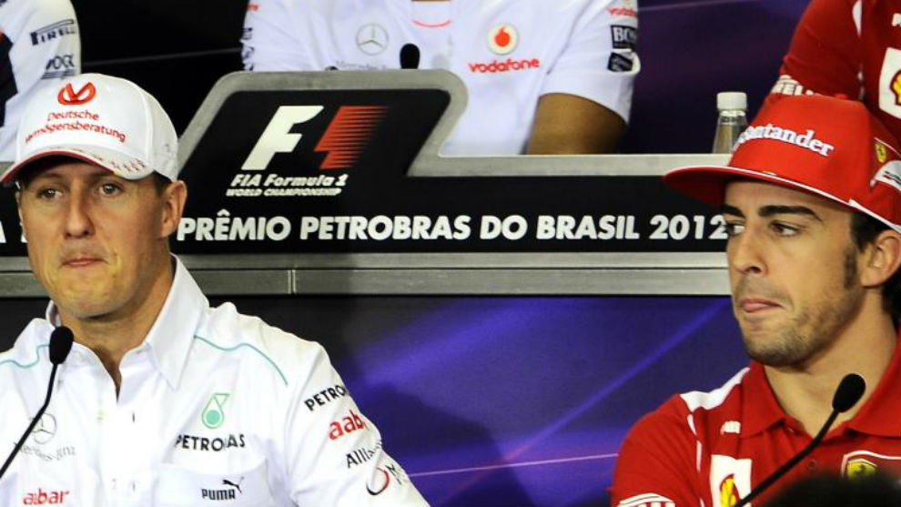 Fernando Alonso y Michael Schumacher, en el GP de Brasil de 2012
