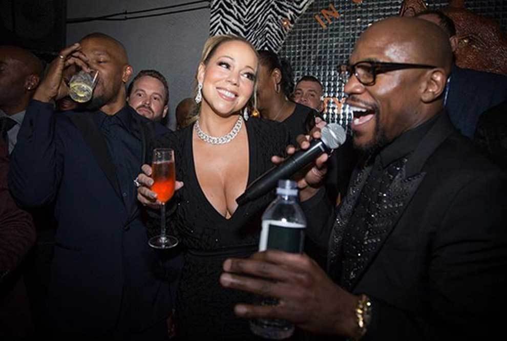 La cantante Mariah Carey y el actor Jamie Foxx junto a Floyd...