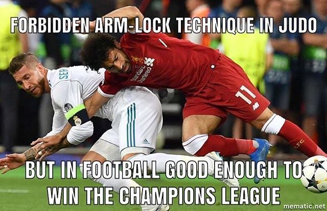 Salah and Ramos fall during the UEFA Champions League final