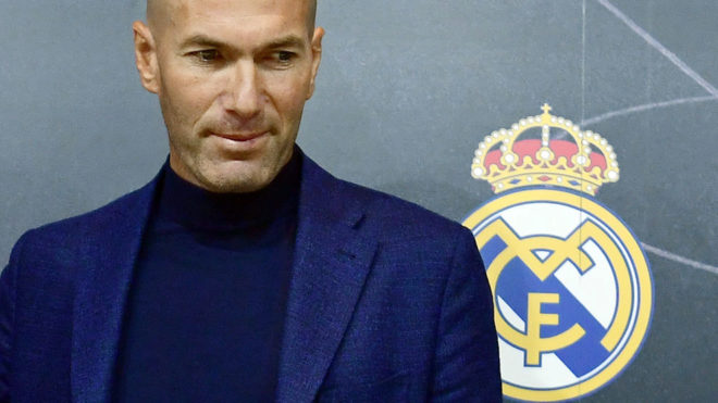 Zinedine Zidane looks on after a press conference to announce his...