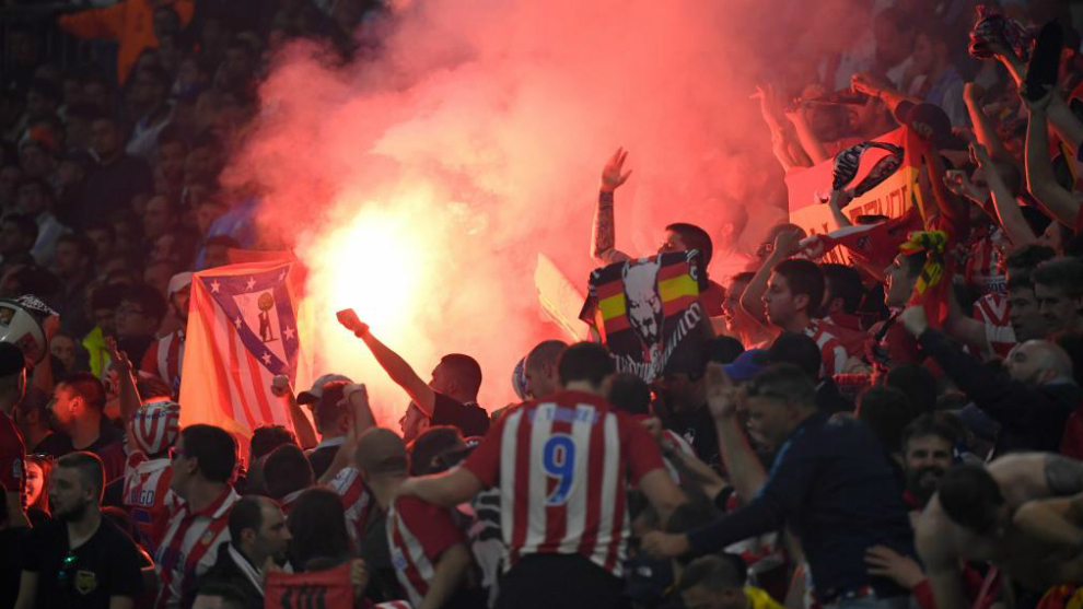 Atletico&apos;s fans light flares during the UEFA Europa League final.