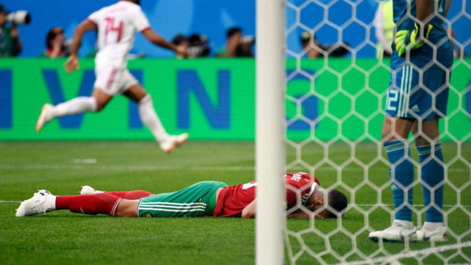 Aziz Bouhaddouz reacts after scoring an own goal