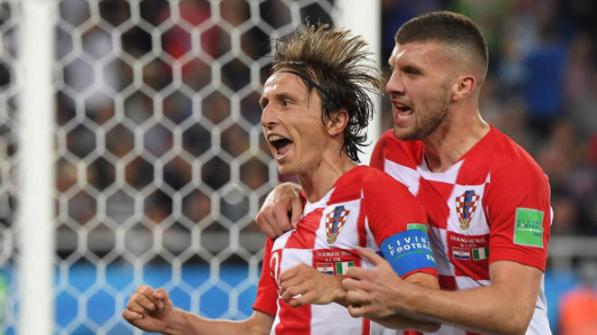 Luka Modric celebrates scoring a penalty with Ante Rebic