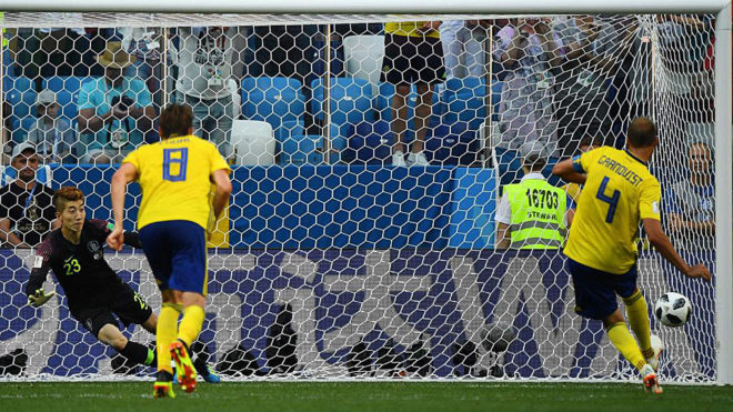Granqvist shoots to score a penalty past South Korea&apos;s goalkeeper Cho...