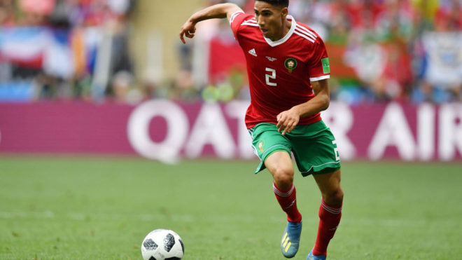 Achraf Hakimi runs with the ball during the match between Portugal and...