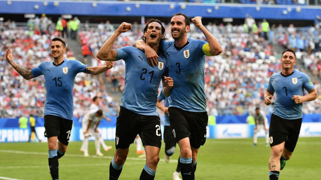 Cavani celebrates with Godin after scoring a goal during the match...