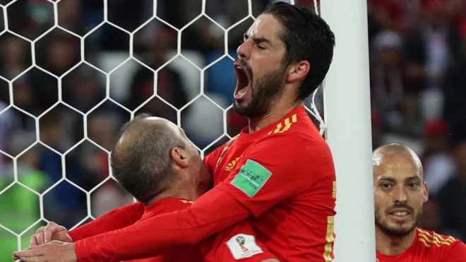 Isco celebrates with Iniesta after scoring the 1-1 goal during the...