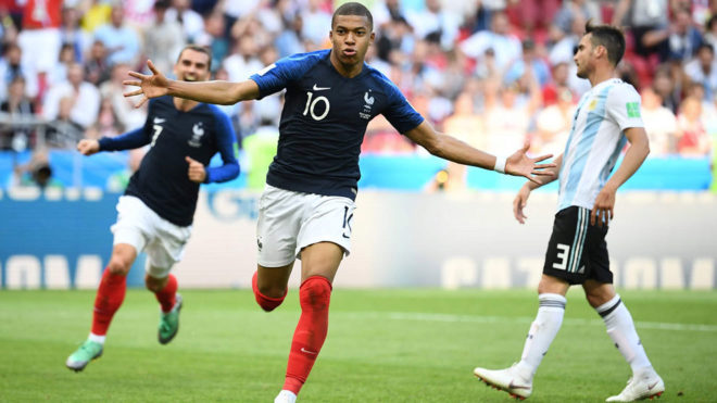 Kylian Mbappe celebrates after scoring their third goal during the...
