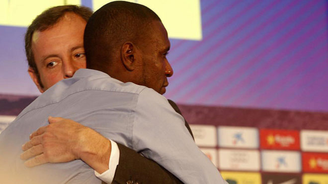 Sandro Rosell and Eric Abidal.