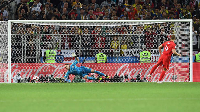 Eric Dier, of England, scores the last penalty against Colombia.
