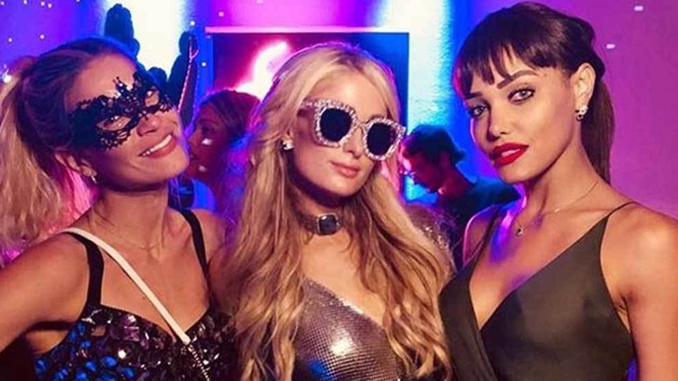 Carla Pereyra, Simeones partner, parties with Paris Hilton in Ibiza.