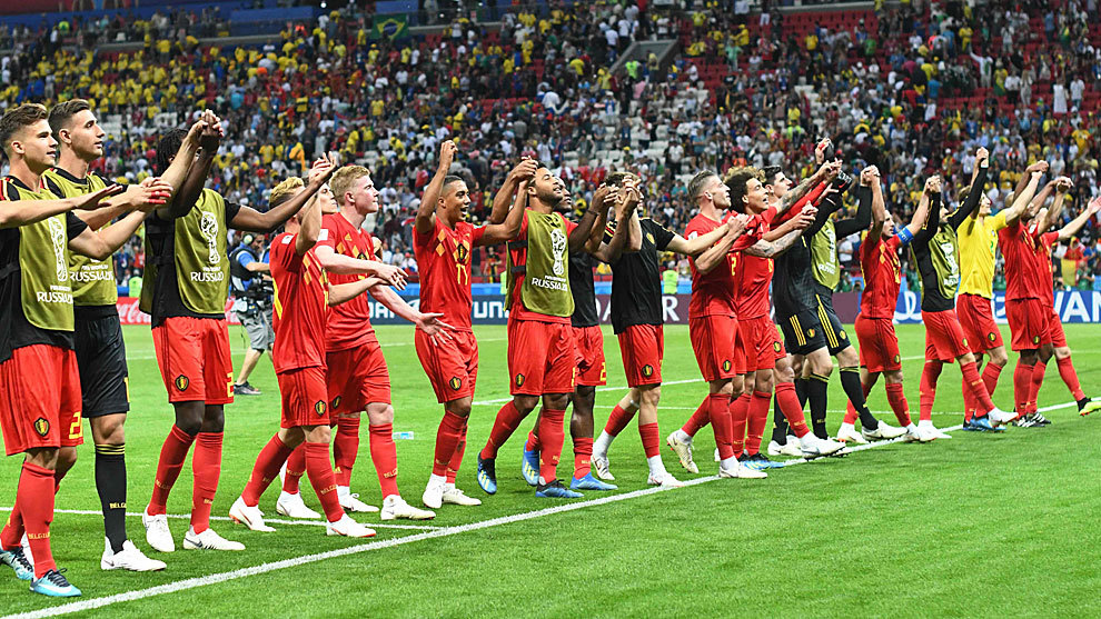 Belgium&apos;s players celebrate at the end of the match between Brazil and...