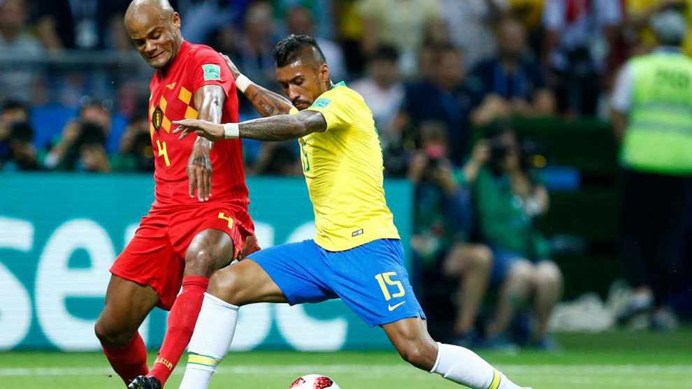 Belgium&apos;s defender Vincent Kompany challenges Brazil&apos;s midfielder...
