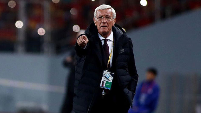 Lippi watches from the sideline during China&apos;s qualifying match...