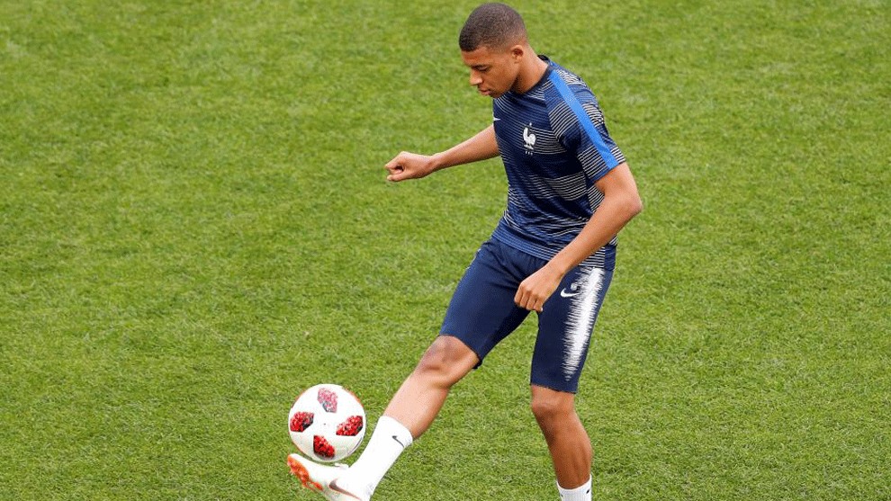 Mbappe warms up before the World Cup final between France and Croatia