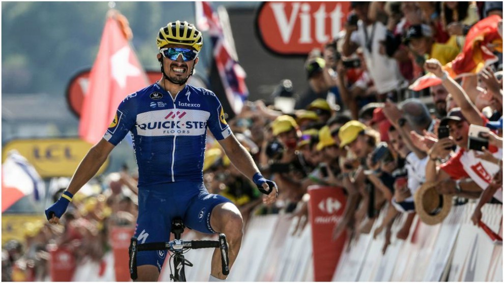 Julian Alaphilippe reacts as he crosses the finish line to win the...