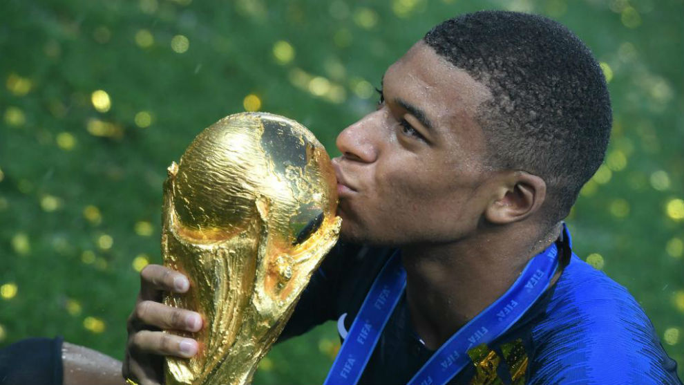 Mbappe kissing the World Cup trophy