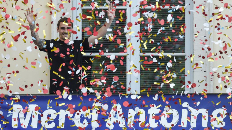 Griezmann stands behind a banner reading &quot;Thank You Antoine&quot;