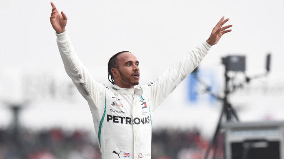 Lewis Hamilton celebrates after he won the German Formula One Grand...