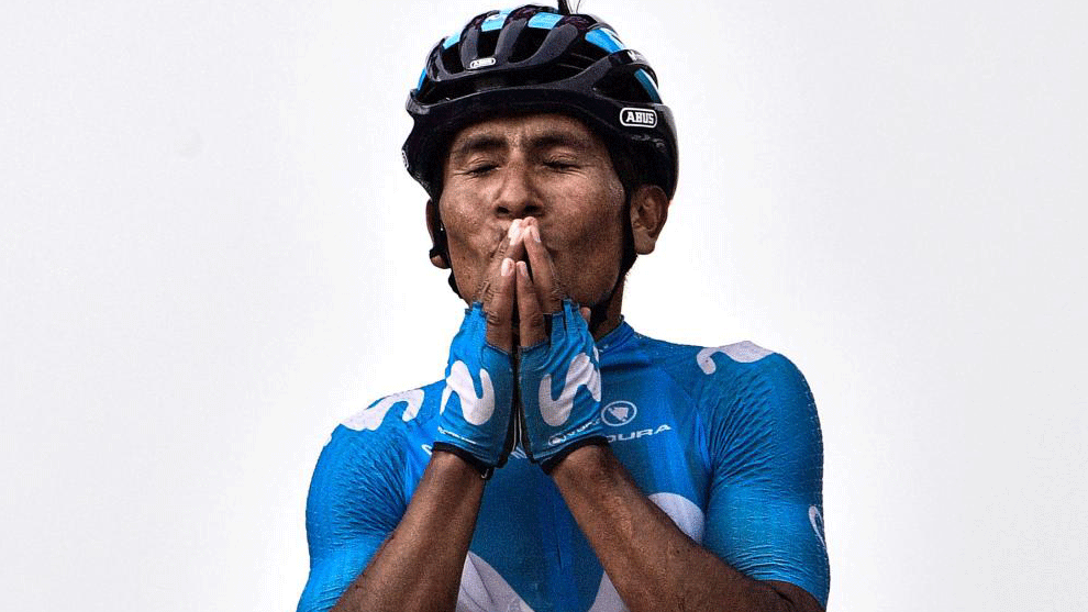Quintana celebrates as he crosses the finish line to win the 17th...