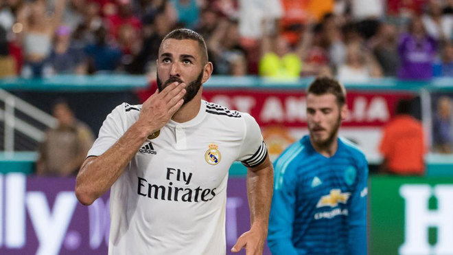 Karim Benzema reacts after scoring a goal