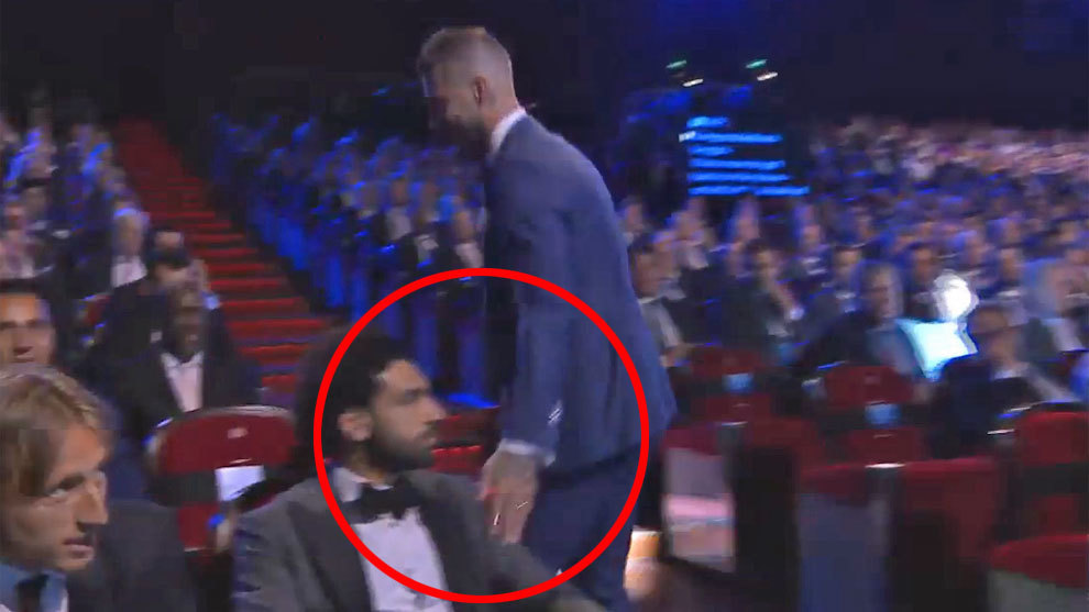 Ramos caressed the left shoulder of Salah