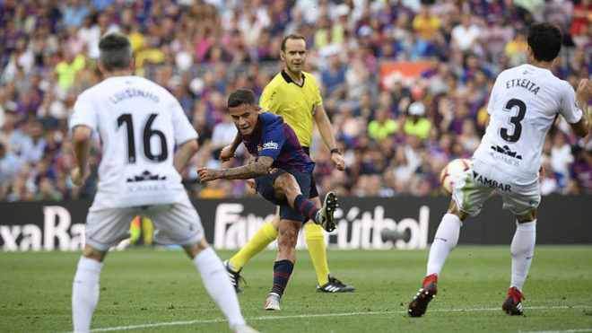 Barcelona&apos;s Brazilian midfielder Philippe Coutinho shoots during the...