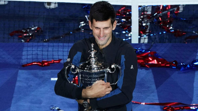 Novak Djokovic of Serbia celebrates his victory over Juan Martin del...