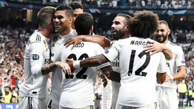 Isco celebrates the opening goal with teammates during the match...