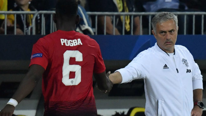Pogba shakes hands with  Mourinho after his substitution during  match...