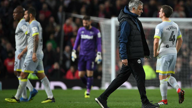 Jose Mourinho leaves Old Trafford dejected.