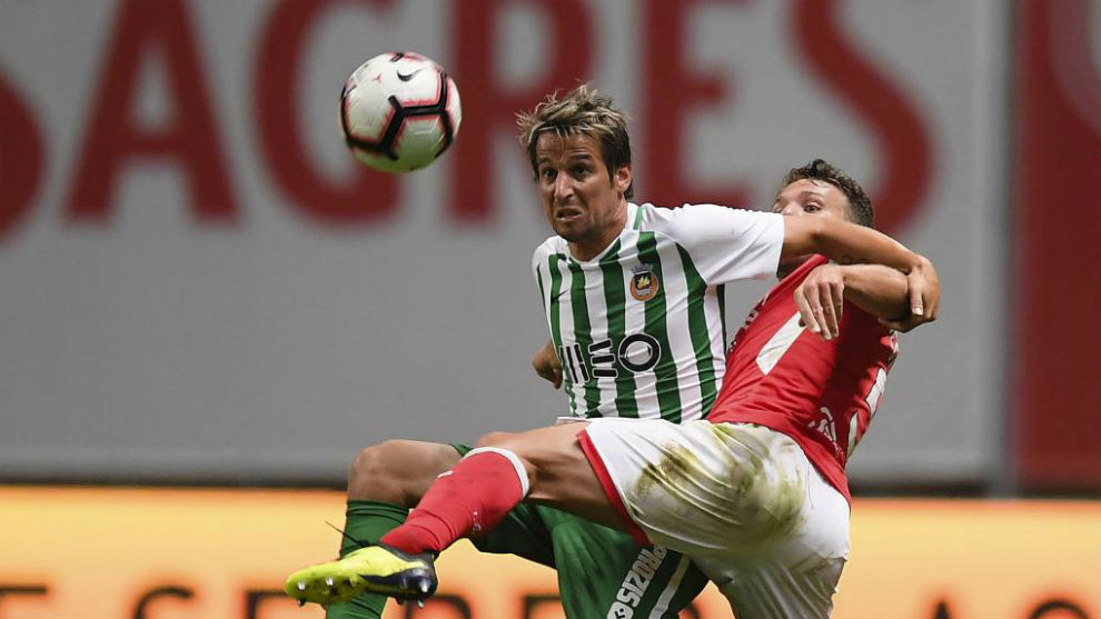 Coentrao fights for the ball against Braga&apos;s Sequeira.